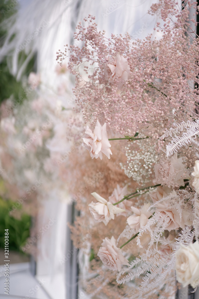 Beautiful blooming pink roses and baby's breath for the wedding