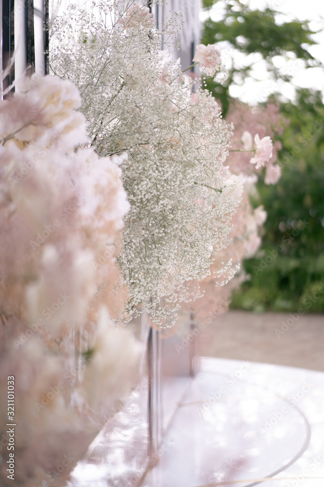 Beautiful blooming pink roses and baby's breath for the wedding
