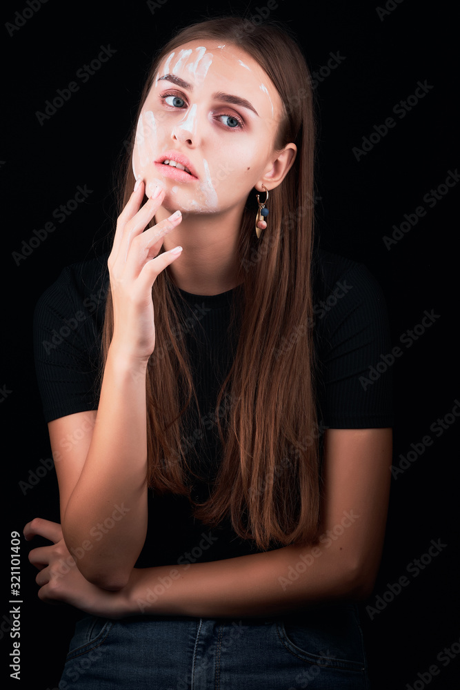 Art portrait of a beautiful girl in white paint. Art portrait of a beautiful girl in white paint.