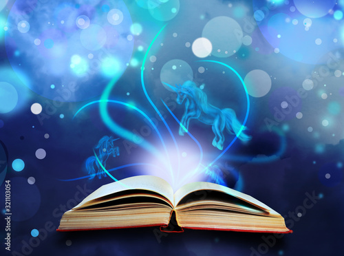 Open book with fairytales and magic lights on blue background. Creative design
