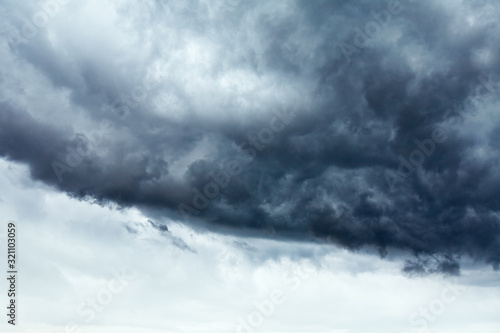 Stormy cloudscape background with clear sky part