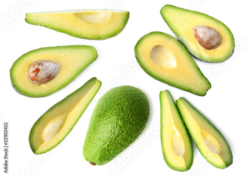 Set of delicious fresh avocados on white background, top view