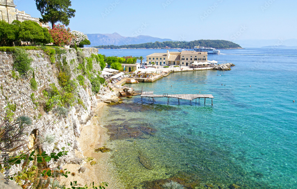 Corfu, Greece. Cliffside Waterfront Recreation area. Clear Ocean water.