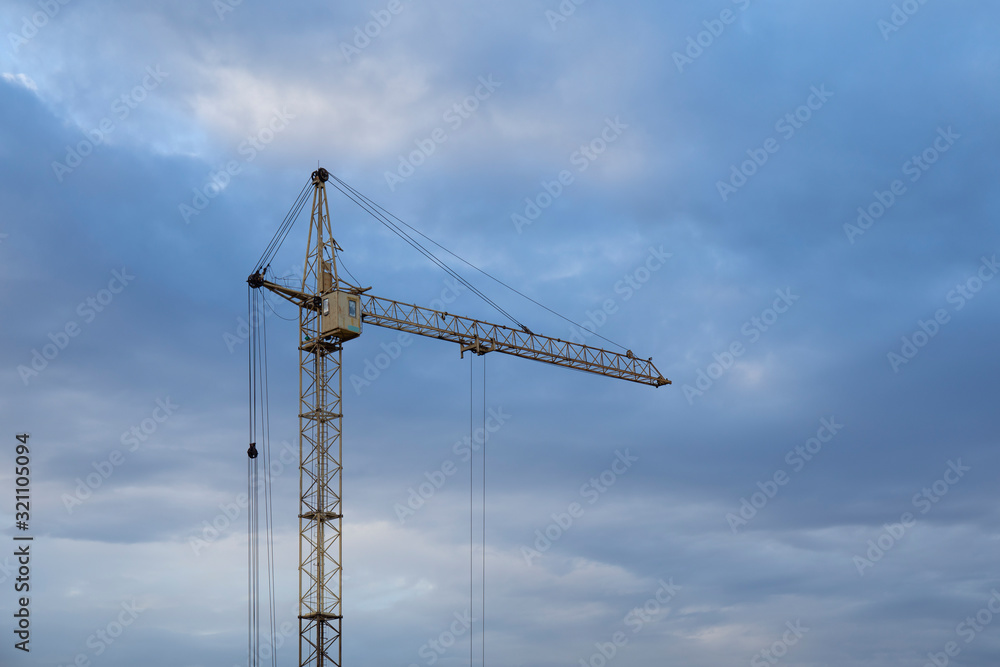 Tower Crane in the clouds and blue sky. Tower Crane in the clouds and blue sky.