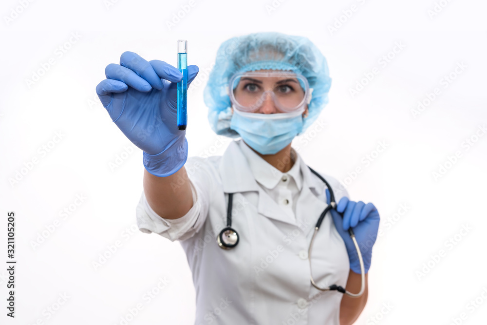 Chemist in protective uniform holding and examining test tube with blue vial substance isolated on white. Woman scientist making experiment Chemist in protective uniform holding and examining test tube with blue vial substance isolated on white. Woman scientist making experiment