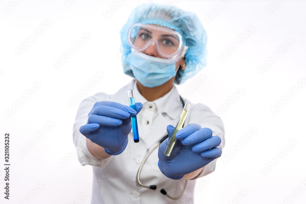 Chemist working in lab. Beautiful woman with test tubes wearing protective uniform and making experiments Chemist working in lab. Beautiful woman with test tubes wearing protective uniform and making experiments