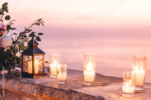 Candles and flowers as decorations in the evening. photo