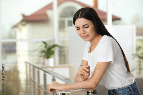 Emotional young woman with nicotine patch and cigarette indoors Free Download Emotional young woman with nicotine patch and cigarette indoors - GFXLoad