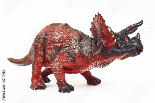 Dinosaur triceratops rubber toy isolated on white © Y