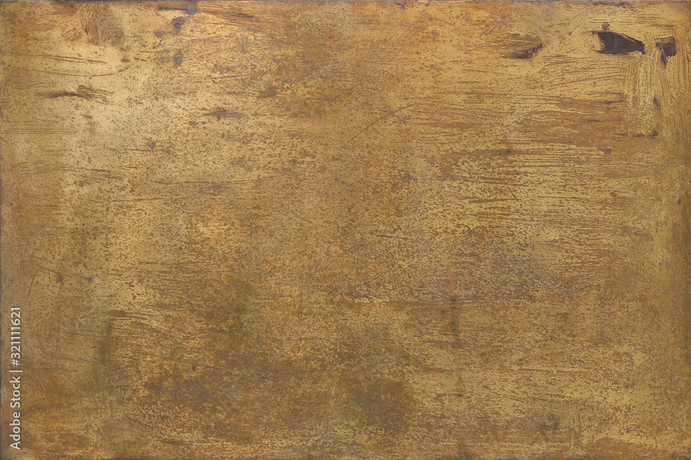 rusty golden metal surface with yellow and orange tones - worn steampunk background with screws and scratches rusty golden metal surface with yellow and orange tones - worn steampunk background with screws and scratches