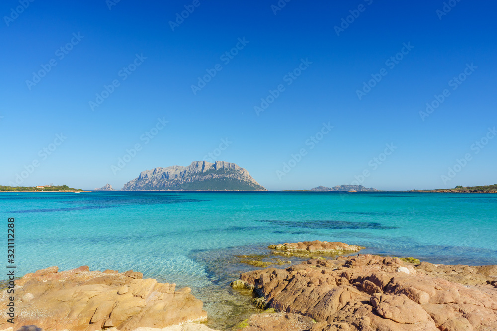 Clear water of sardinian beachs with view on Tavolara island