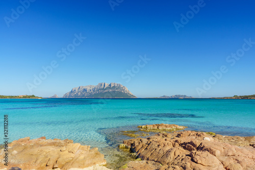 Clear water of sardinian beachs with view on Tavolara island