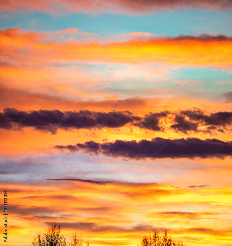 Panorama of colorful x clouds in the sunset sky