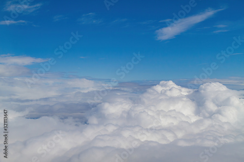 Sunny aerial sky landscape from and airplane window seat © Kit Leong