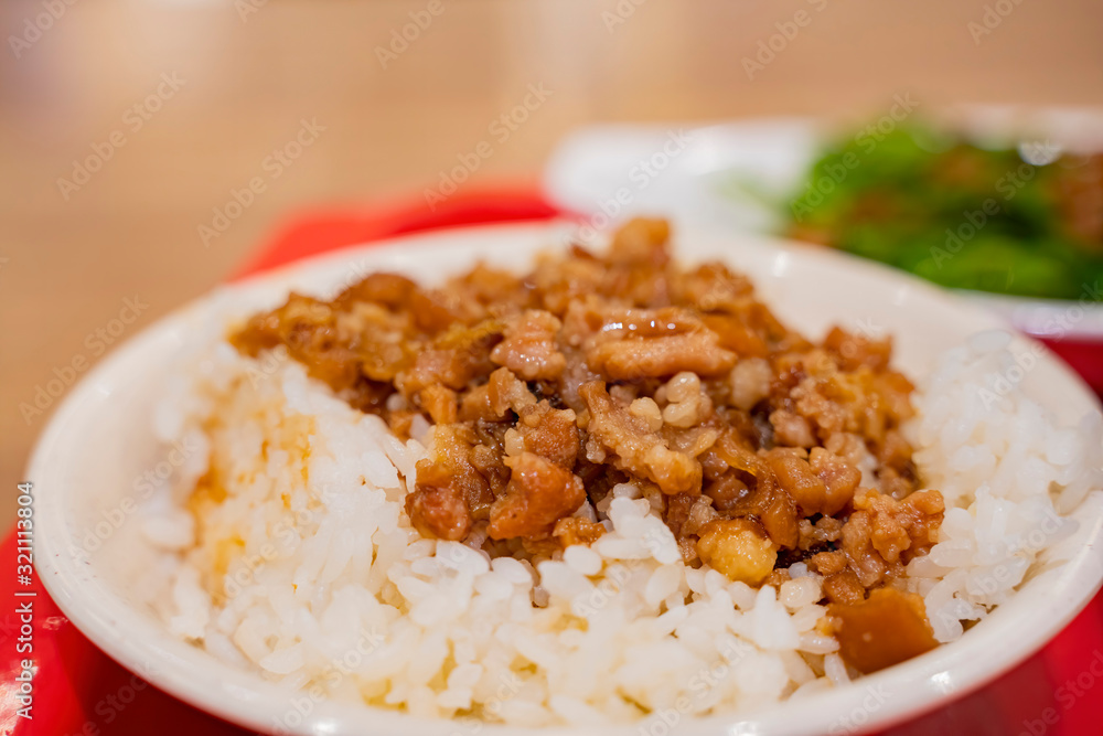 Close up shot of a bowl of braised pork rice Close up shot of a bowl of braised pork rice