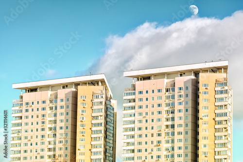 Photography modern residential building in moscow city urban architecture against clouds sky with moon background