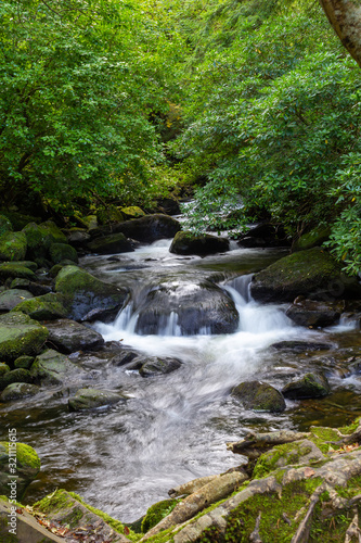 Brook water flowing over rocks 2