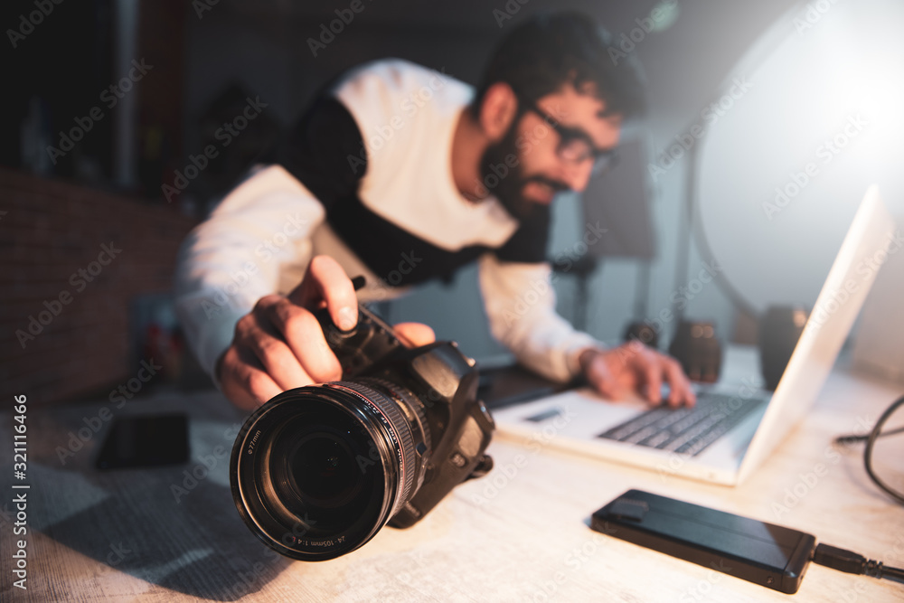 photographer hand camera with keyboard on desk photographer hand camera with keyboard on desk