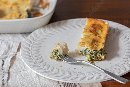 Crespelle crepes filled with spinach and ricotta cheese. photo