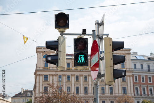 Traffic light system with the famous pair of traffic lights in Vienna shows green and traffic sign 'no entry'.