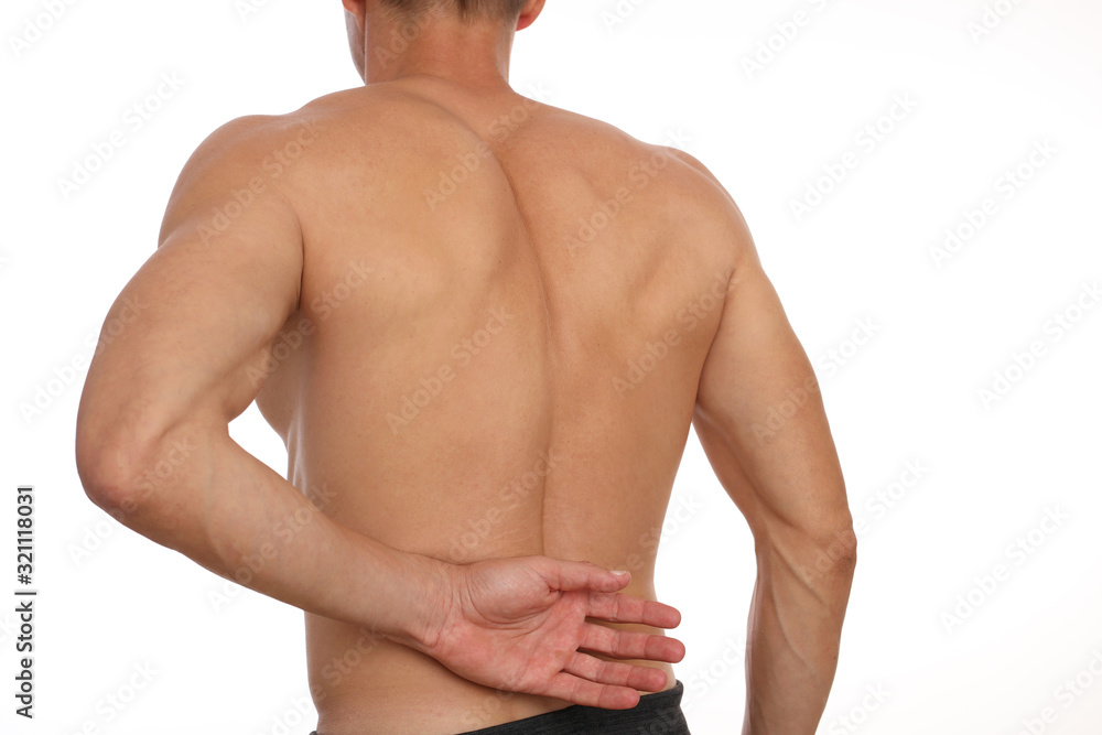 Man suffering from back pain. Muscle spasm . Chiropractic concept. Sport exercising injury