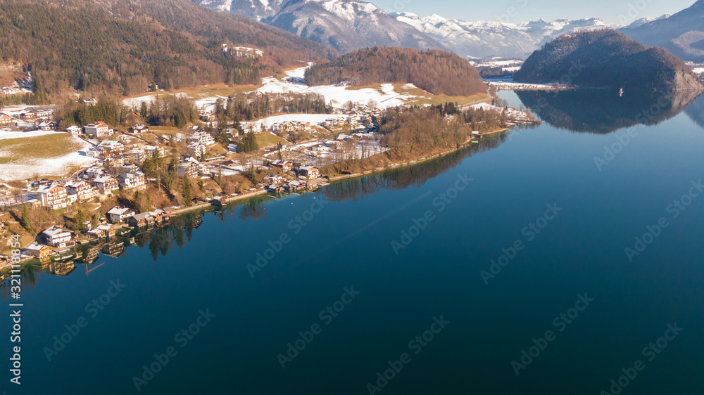 Aerial view on houses near water, small alpine village St. Wolfgang and Wolfgangsee  Lake in Austria