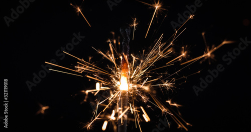 Wallpaper Mural Firework festive sparkler burning on black background Torontodigital.ca