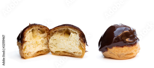 фотографія Homemade profiteroles covered with chocolate isolated on white