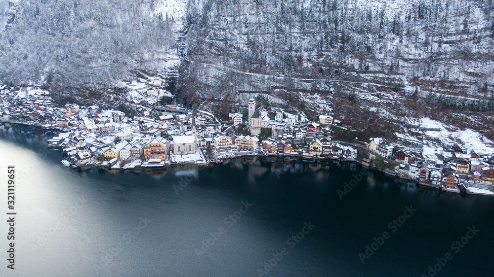 Hallstatt Austria, Aerial view on houses in small alpine village, mountains and lake winter time 
