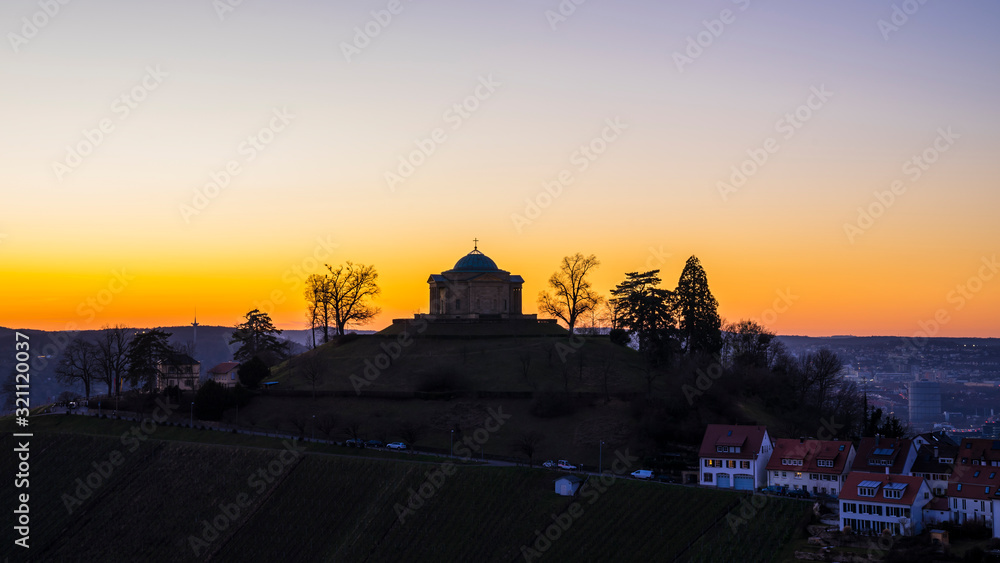 Germany, Beautiful ancient mausoleum, tomb chapel on top of rotenberg mountain with view over stuttgart city at night with red afterglow sky