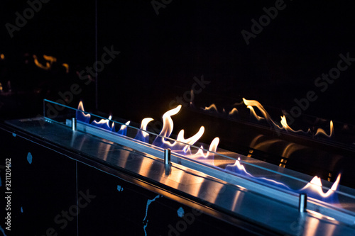 fire in a biofireplace.  Modern bio fireplot fireplace on ethanol gas.
