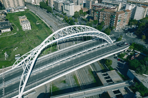 Road bridge over railroad in Rome, Italy, aerial view from drone.
