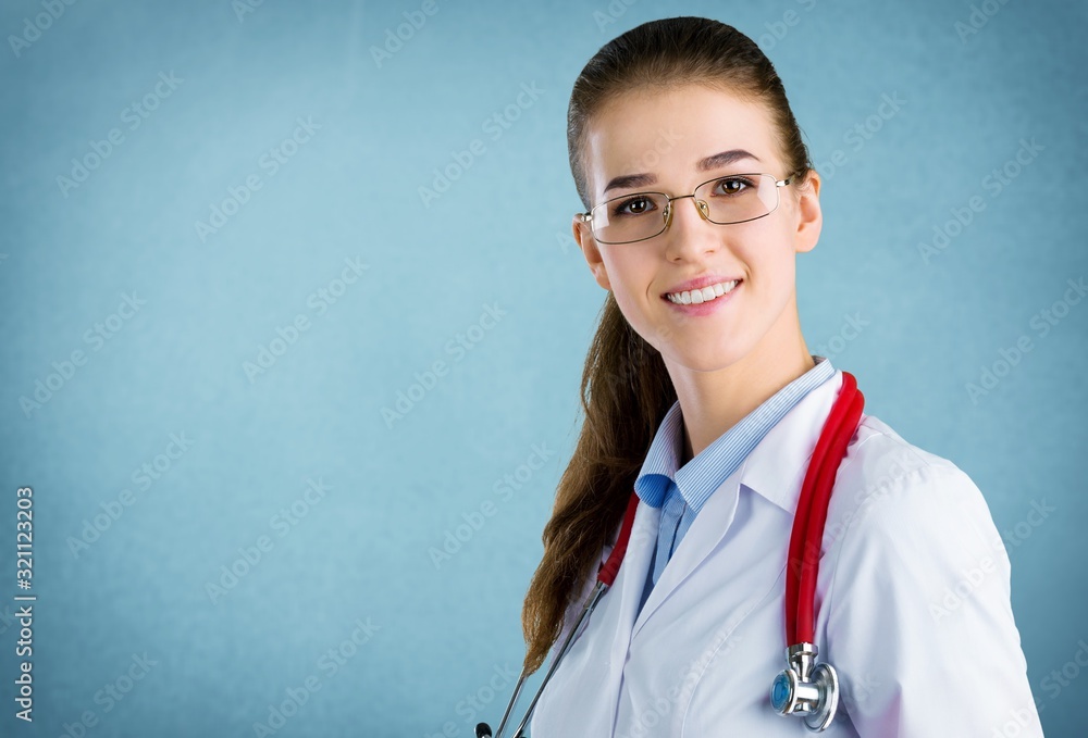 A young woman doctor in glasses with a stethoscope A young woman doctor in glasses with a stethoscope