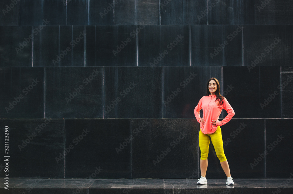 Beautiful sporty fitness woman posing outdoor after workout Beautiful sporty fitness woman posing outdoor after workout