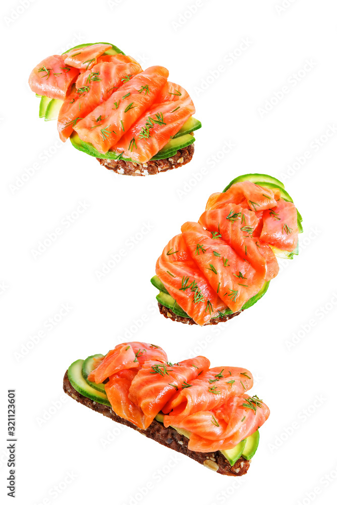 Smoked salmon avocado rye sandwich on a white isolated background Smoked salmon avocado rye sandwich on a white isolated background
