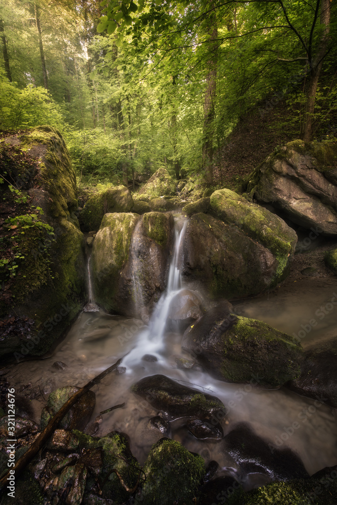 Golden light over a small waterfall