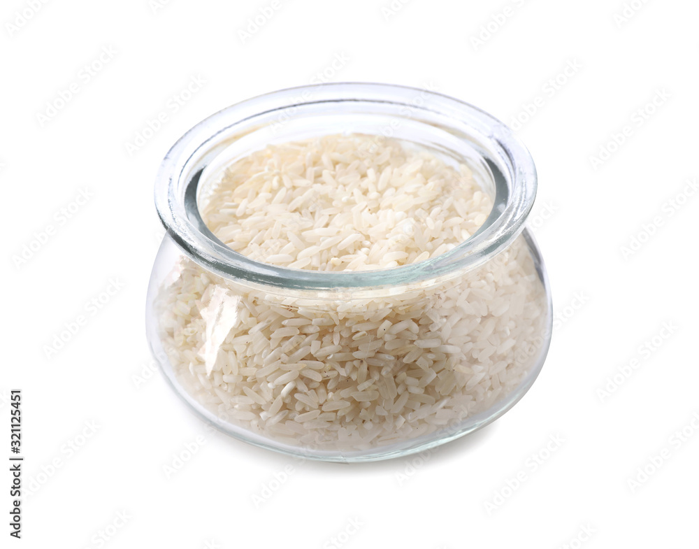 Uncooked rice in glass jar isolated on white Uncooked rice in glass jar isolated on white