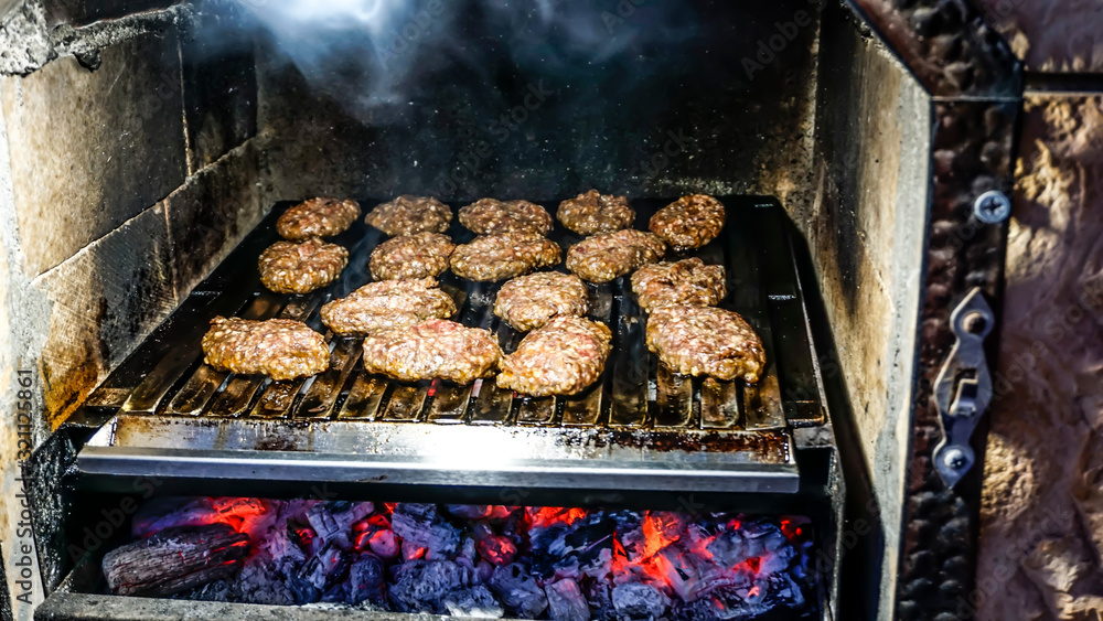 Meatballs is being cooked in barbecue. Meatballs is being cooked in barbecue.