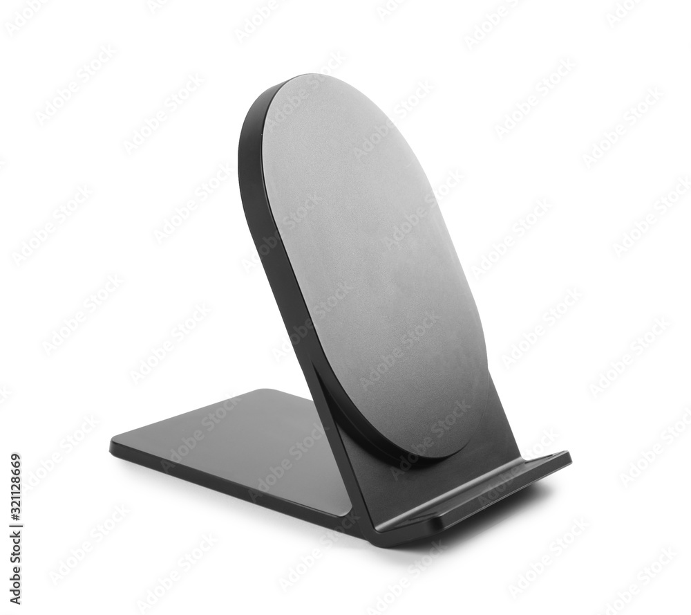 Black wireless charger isolated on white. Modern technology Black wireless charger isolated on white. Modern technology
