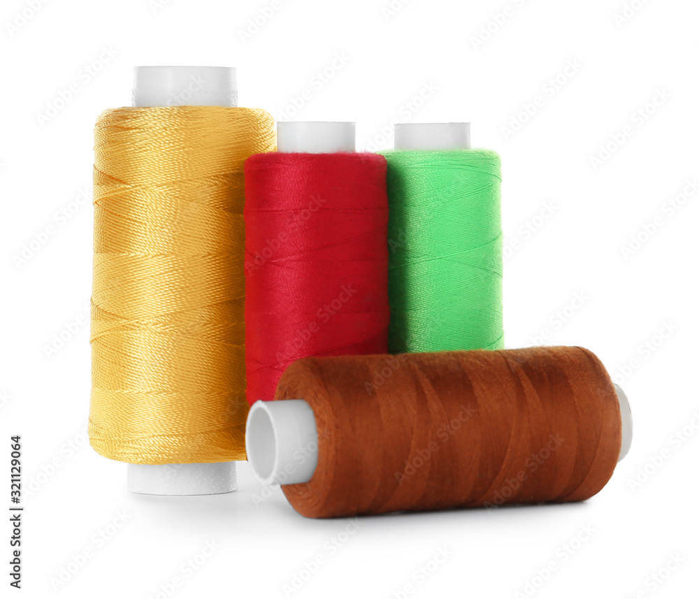 Set of color sewing threads isolated on white