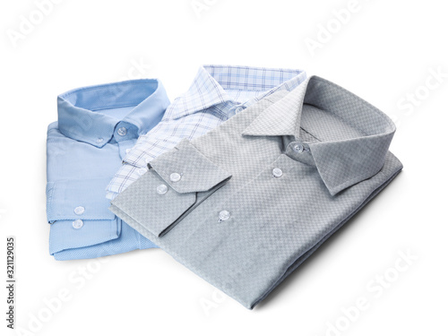 Different stylish male shirts isolated on white