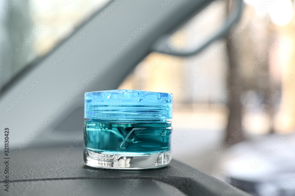 Stylish air freshener on dashboard in car Stylish air freshener on dashboard in car