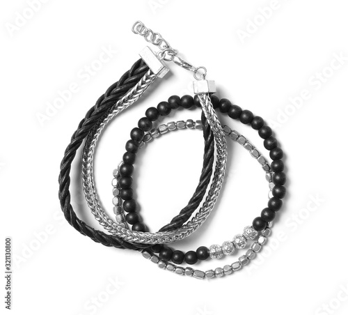 Stylish bracelets isolated on white, top view