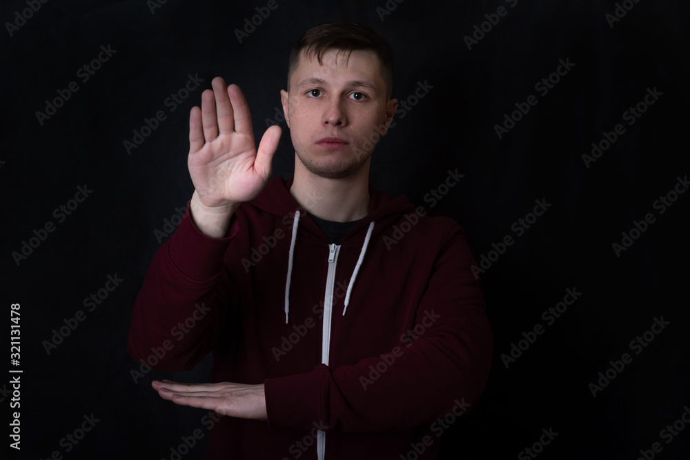 deaf and dumb young man shows a gesture to deaf and dumb young man shows a gesture to