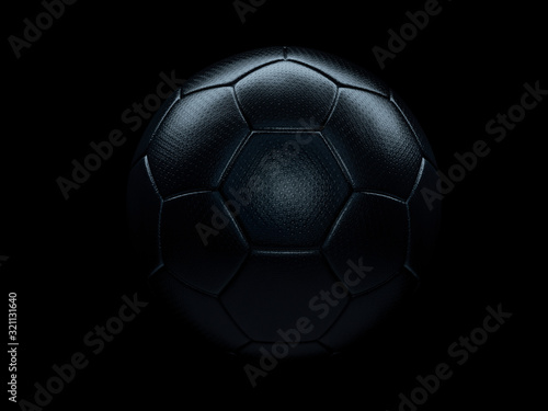 Black soccer ball against black background. © Martin Piechotta