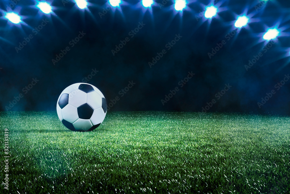 Fototapeta premium Football or soccer ball background with spotlights