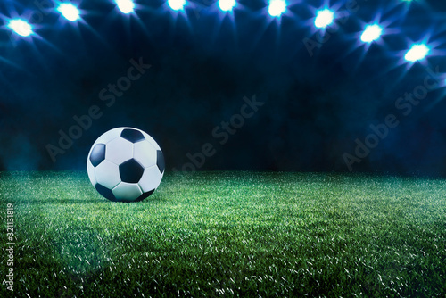 Football or soccer ball background with spotlights