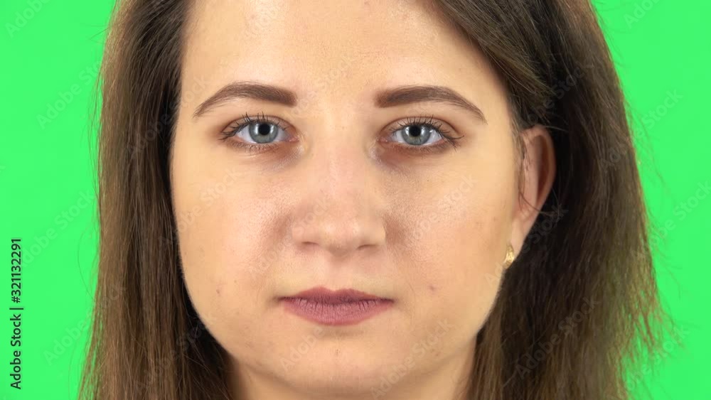Girl is looking at the camera. Close up. Green screen Girl is looking at the camera. Close up. Green screen