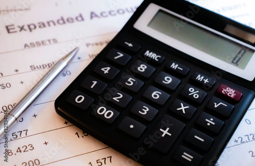 reduction of the financial balance and calculations on the calculator