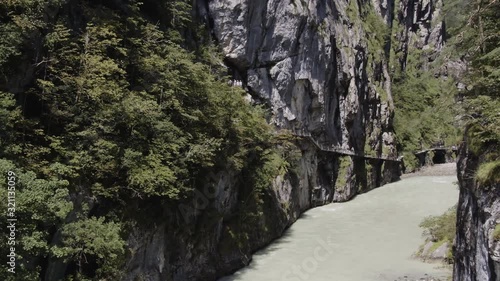 Drone footage of river amidst mountains, Aareschlucht, Berner Oberland, Switzerland photo